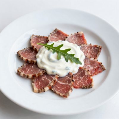 Carpaccio di manzo in salsa alla rucola
